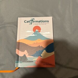 Cat-themed affirmations journal with quotes and spaces to write and prompts